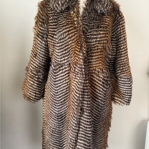 Faux fur coat says size L fits a small and 3/4 sleeve very elegant